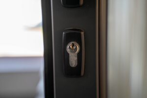 Close-up of a steel door keyhole and lock for inspecting front-door security