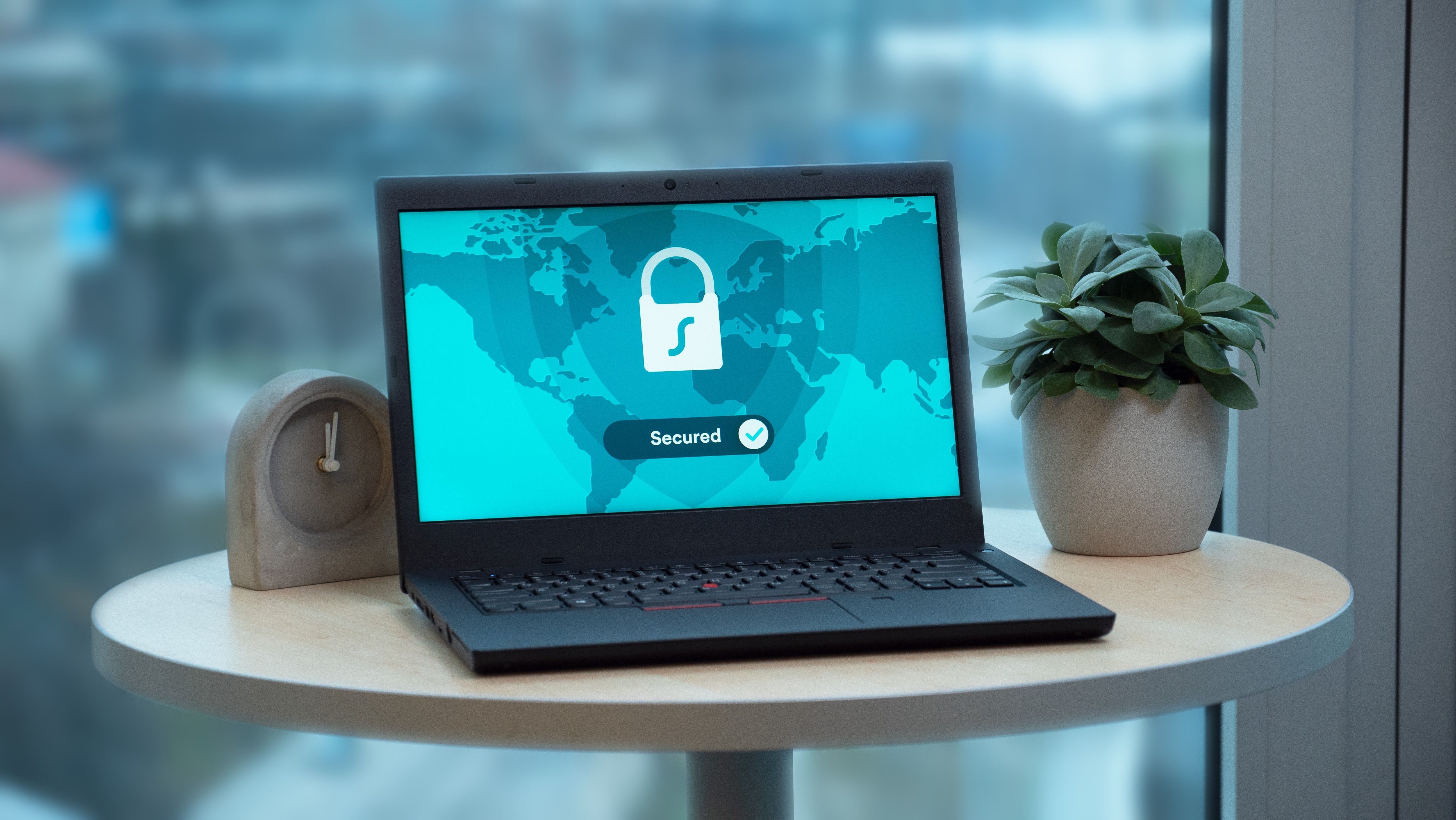 Laptop displaying a security lock icon, representing protected intelligence and secure information.
